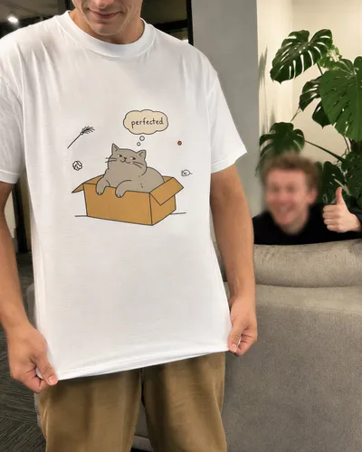 Holding up an Unsame smug cat tee